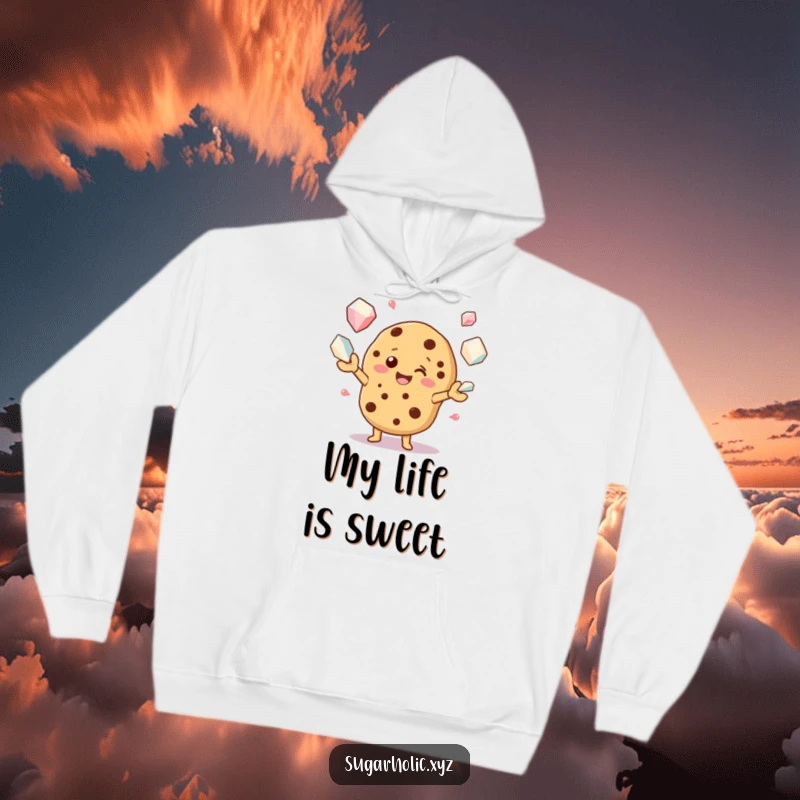 Funny hoodie depicting a cheerful cookie character gleefully juggling oversized sugar crystals, perfect for cozy humor lovers.