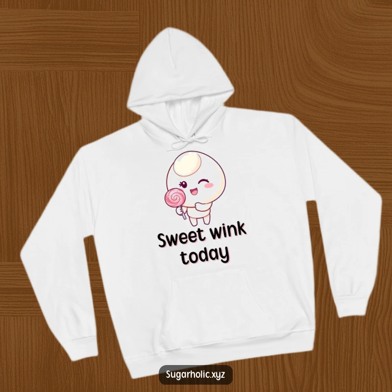 Funny hoodie featuring a candy character with a cheerful wink, holding a glittering lollipop, perfect for cozy days.