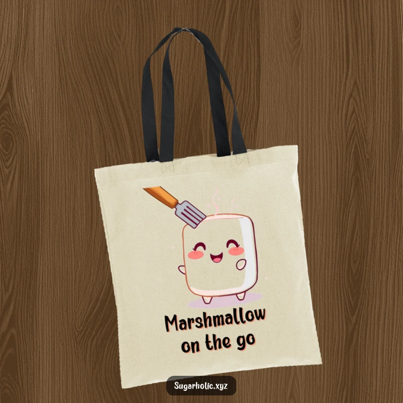 Funny tote bag with a cheerful, blushing marshmallow being toasted, perfect for carrying goodies with a smile.